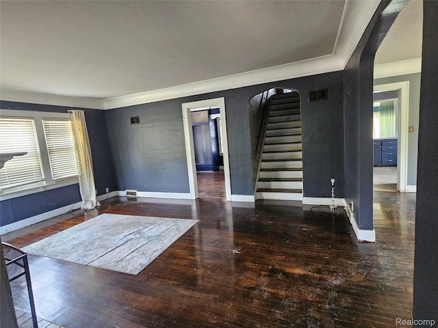 607 Roome Ct, Flint, MI 48503 - spare room featuring hardwood / wood-style floors, healthy amount of natural light, stairs, and crown molding