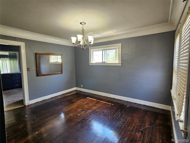 607 Roome Ct, Flint, MI 48503 - empty room with a chandelier, dark wood-type flooring, and ornamental molding