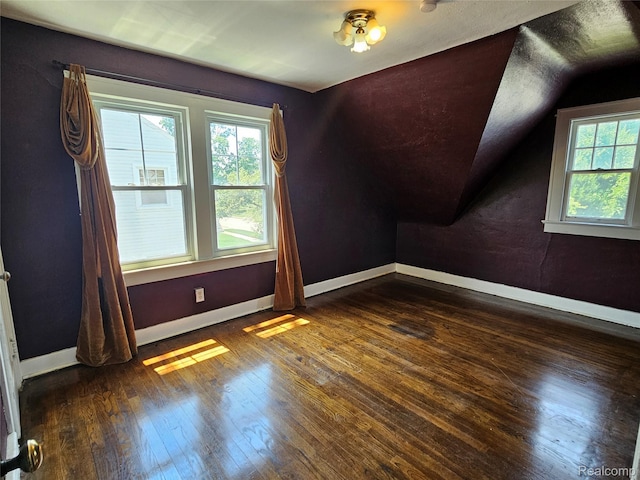 607 Roome Ct, Flint, MI 48503 - bonus room with dark wood finished floors and vaulted ceiling