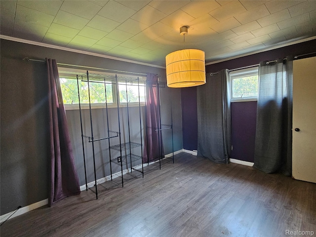 607 Roome Ct, Flint, MI 48503 - unfurnished dining area featuring crown molding and wood finished floors