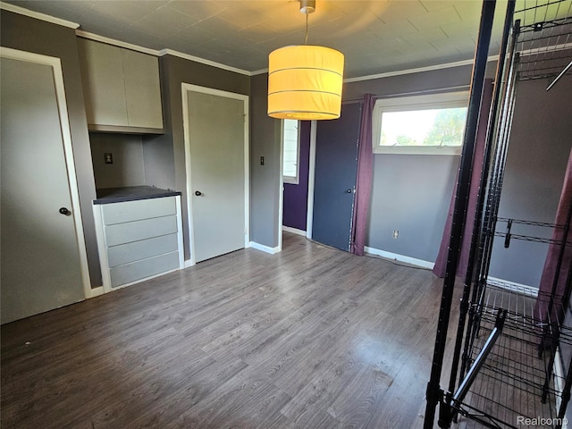 607 Roome Ct, Flint, MI 48503 - unfurnished bedroom with crown molding and wood finished floors