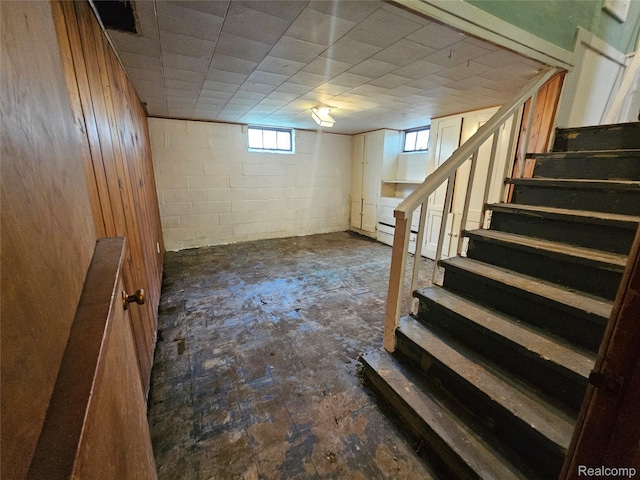 607 Roome Ct, Flint, MI 48503 - basement featuring stairs and concrete block wall