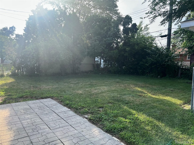 33158 Shawnee St, Westland, MI 48185 - view of grassy yard with a patio