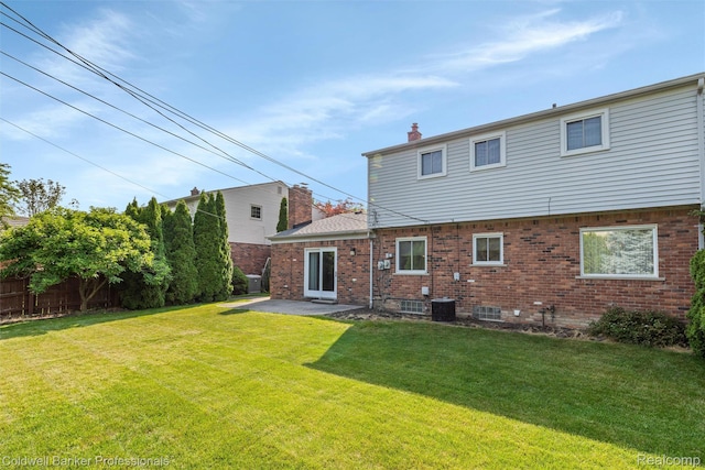21600 Eastbrook Ct, Grosse Pointe Woods, MI 48236 - rear view of house with brick siding, a chimney, and a patio