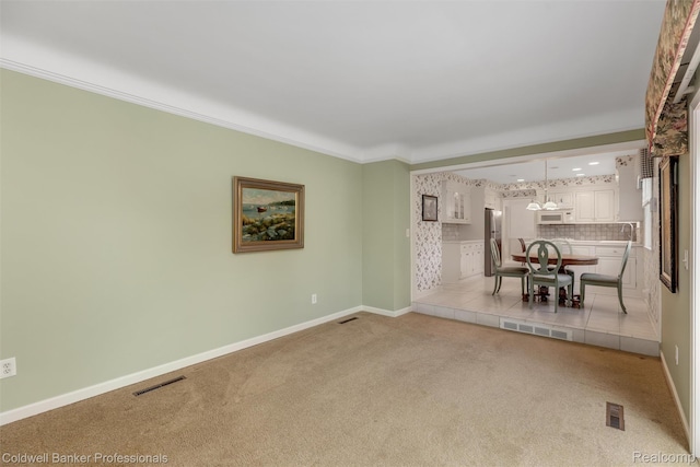21600 Eastbrook Ct, Grosse Pointe Woods, MI 48236 - unfurnished living room with light carpet, ornamental molding, and a chandelier
