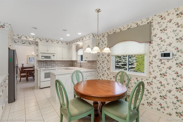 21600 Eastbrook Ct, Grosse Pointe Woods, MI 48236 - dining room with light tile patterned floors, wallpapered walls, and recessed lighting