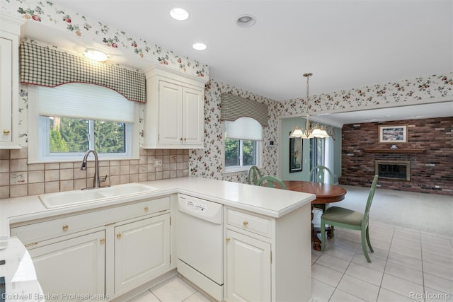 21600 Eastbrook Ct, Grosse Pointe Woods, MI 48236 - kitchen featuring dishwasher, light tile patterned floors, wallpapered walls, light countertops, and open floor plan