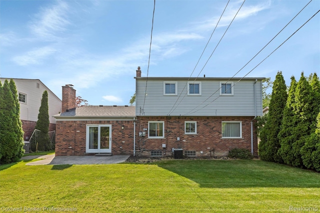 21600 Eastbrook Ct, Grosse Pointe Woods, MI 48236 - back of house with a yard, a patio, brick siding, and a chimney