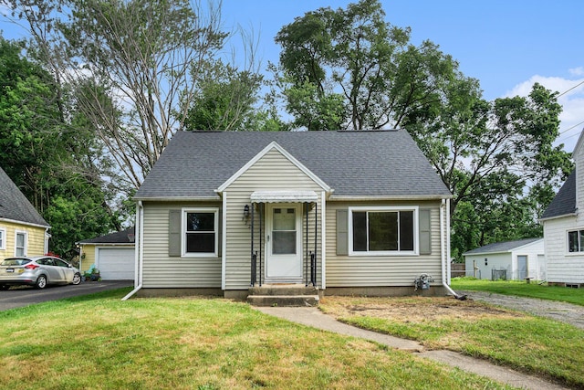932 Parker Ave, Kalamazoo, MI 49008 - view of front facade with entry steps, a front lawn, a garage, and roof with shingles