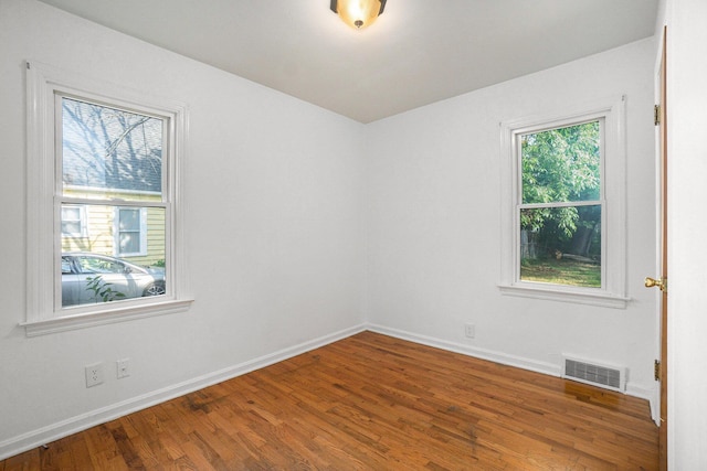932 Parker Ave, Kalamazoo, MI 49008 - spare room with wood finished floors and baseboards