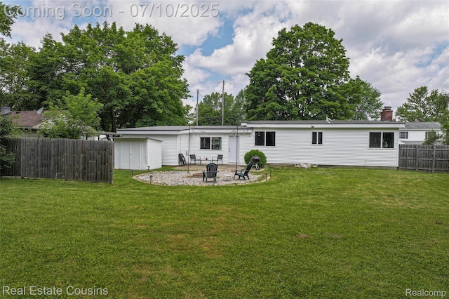 135 Bevins St, Holly, MI 48442 - back of property with a fire pit, a storage unit, and a patio area