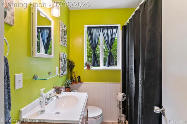 135 Bevins St, Holly, MI 48442 - bathroom featuring vanity and a wainscoted wall