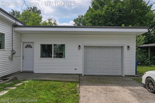 135 Bevins St, Holly, MI 48442 - garage with concrete driveway