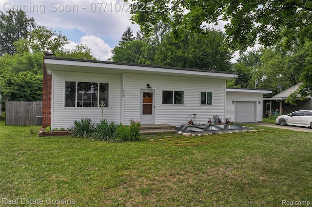 135 Bevins St, Holly, MI 48442 - view of front of house with a garage and driveway