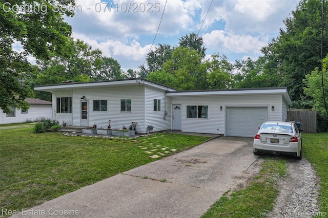 135 Bevins St, Holly, MI 48442 - view of front of property with a garage, concrete driveway, and a front lawn