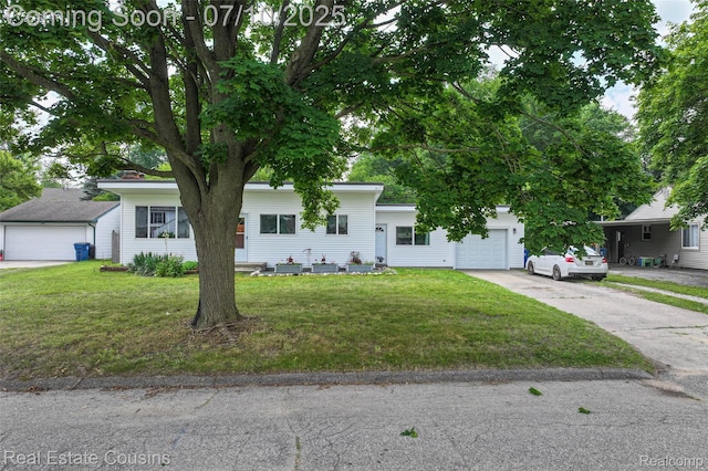 135 Bevins St, Holly, MI 48442 - view of front of property with an attached garage, driveway, and a front yard