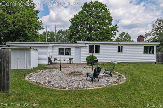 135 Bevins St, Holly, MI 48442 - rear view of property with a chimney, a patio, and a storage shed