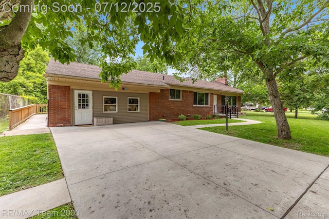 27055 Ann Arbor Trl, Dearborn Heights, MI 48127 - single story home featuring brick siding, a chimney, driveway, and roof with shingles