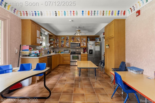 27055 Ann Arbor Trl, Dearborn Heights, MI 48127 - kitchen with stainless steel appliances, ceiling fan, light countertops, open shelves, and light tile patterned floors
