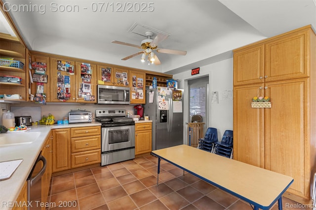 27055 Ann Arbor Trl, Dearborn Heights, MI 48127 - kitchen featuring appliances with stainless steel finishes, ceiling fan, light countertops, and tile patterned floors