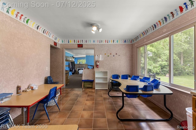 27055 Ann Arbor Trl, Dearborn Heights, MI 48127 - dining room with tile patterned flooring and a fireplace