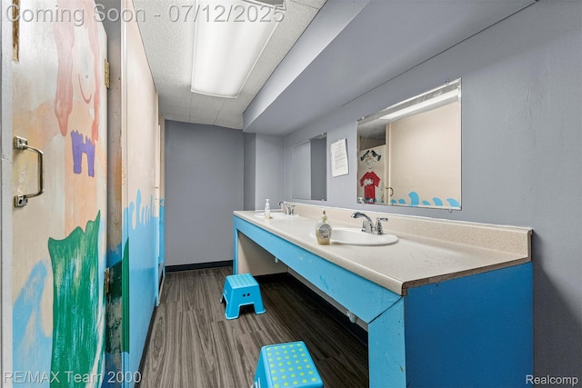 27055 Ann Arbor Trl, Dearborn Heights, MI 48127 - full bathroom featuring double vanity and wood finished floors