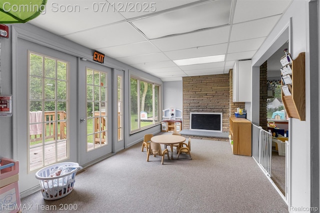 27055 Ann Arbor Trl, Dearborn Heights, MI 48127 - living room featuring a drop ceiling, a fireplace, and carpet