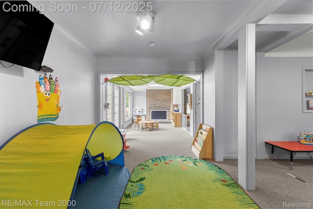 27055 Ann Arbor Trl, Dearborn Heights, MI 48127 - carpeted bedroom featuring a fireplace and baseboards