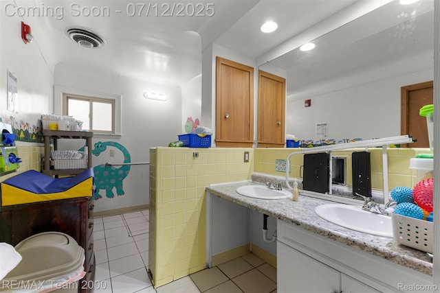 27055 Ann Arbor Trl, Dearborn Heights, MI 48127 - full bathroom with double vanity and tile patterned floors