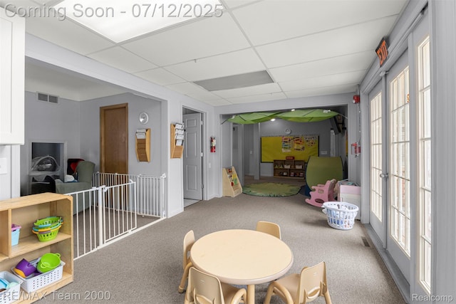 27055 Ann Arbor Trl, Dearborn Heights, MI 48127 - recreation room with a drop ceiling, carpet flooring, and healthy amount of natural light