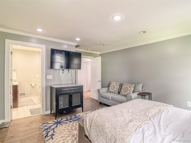 1454 Stephens Ave, Flint, MI 48507 - bedroom with wood finished floors, recessed lighting, crown molding, and ensuite bathroom
