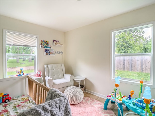 1454 Stephens Ave, Flint, MI 48507 - bedroom featuring wood finished floors and multiple windows