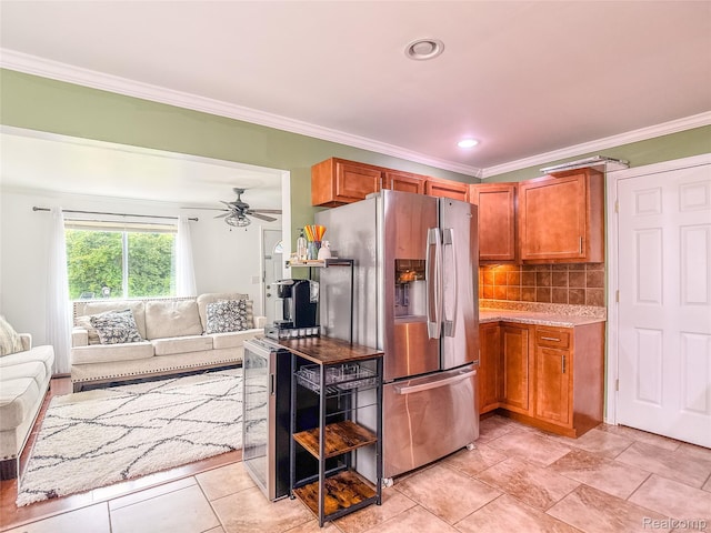 1454 Stephens Ave, Flint, MI 48507 - kitchen featuring stainless steel fridge, open floor plan, crown molding, a ceiling fan, and brown cabinetry