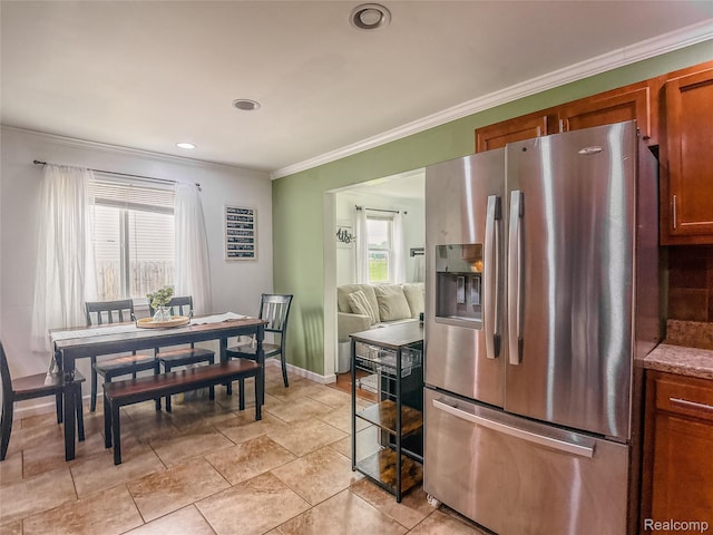 1454 Stephens Ave, Flint, MI 48507 - kitchen featuring stainless steel fridge, healthy amount of natural light, crown molding, wine cooler, and brown cabinets