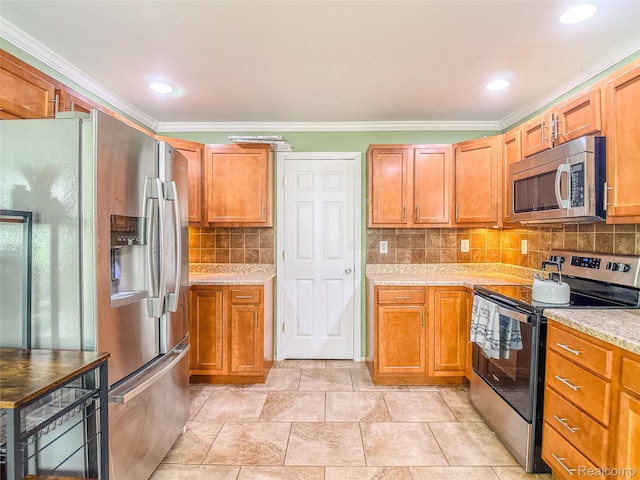 1454 Stephens Ave, Flint, MI 48507 - kitchen with stainless steel appliances, ornamental molding, tasteful backsplash, brown cabinets, and light stone counters