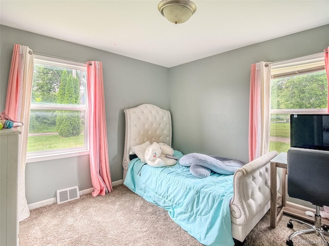 1454 Stephens Ave, Flint, MI 48507 - carpeted bedroom featuring multiple windows