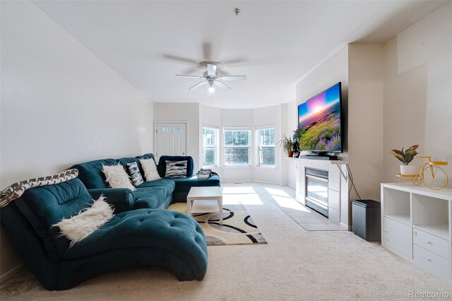 41666 Tera Ln, Novi, MI 48375 - carpeted living area with a ceiling fan and a fireplace