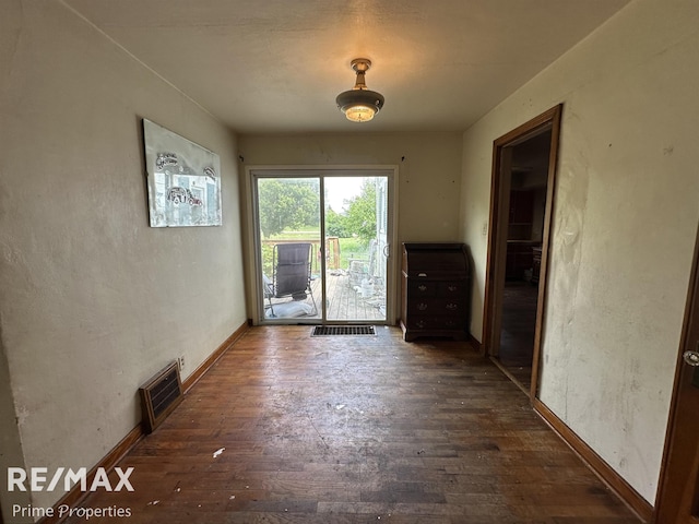 1615 Pound Dr, Flint, MI 48532 - unfurnished dining area featuring hardwood / wood-style floors and baseboards