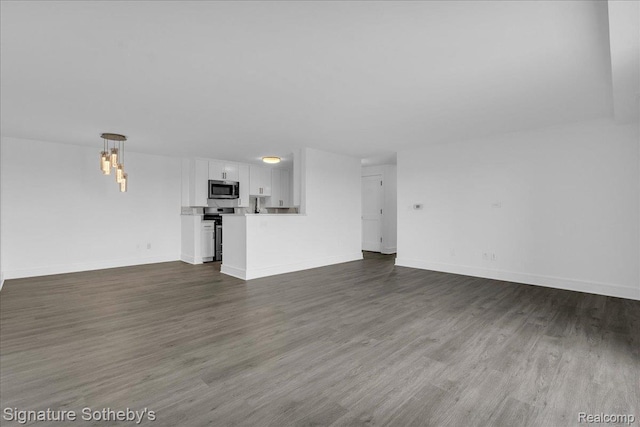 411 S Old Woodward Ave Unit 924, Birmingham, MI 48009 - unfurnished living room with dark wood finished floors