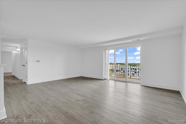 411 S Old Woodward Ave Unit 924, Birmingham, MI 48009 - spare room with wood finished floors and baseboards