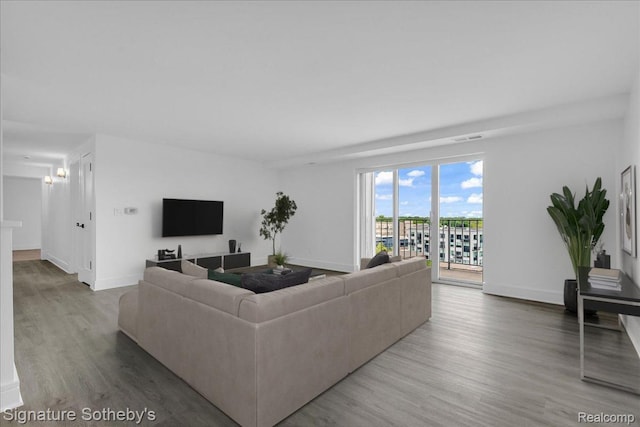 411 S Old Woodward Ave Unit 924, Birmingham, MI 48009 - living area featuring wood finished floors and baseboards
