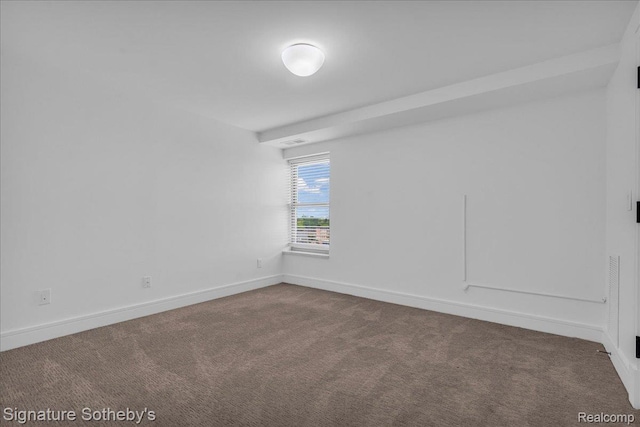 411 S Old Woodward Ave Unit 924, Birmingham, MI 48009 - spare room featuring dark colored carpet and baseboards