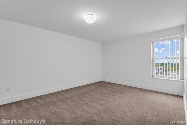 411 S Old Woodward Ave Unit 924, Birmingham, MI 48009 - carpeted spare room featuring baseboards