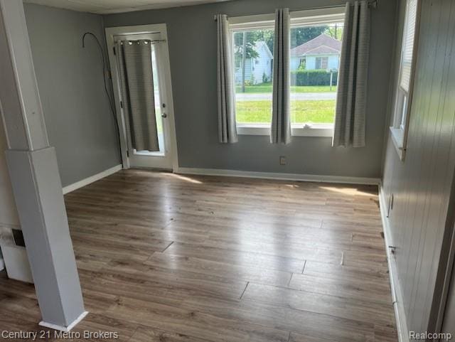 2117 E Buder Ave, Flint, MI 48529 - empty room featuring wood finished floors and baseboards