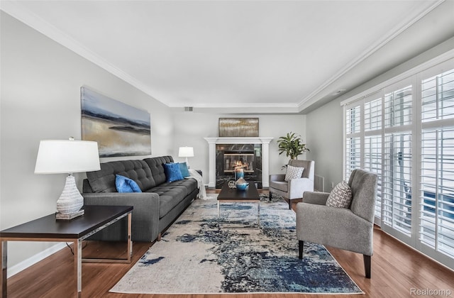 3553 Port Cove Dr Unit 39, Waterford, MI 48328 - living area featuring wood finished floors, ornamental molding, and a fireplace