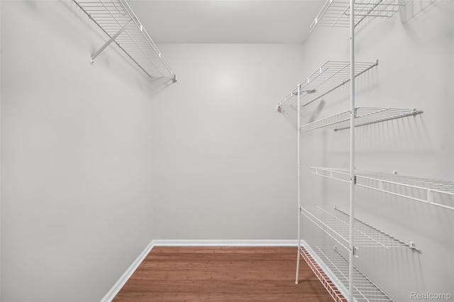 3553 Port Cove Dr Unit 39, Waterford, MI 48328 - walk in closet with wood finished floors