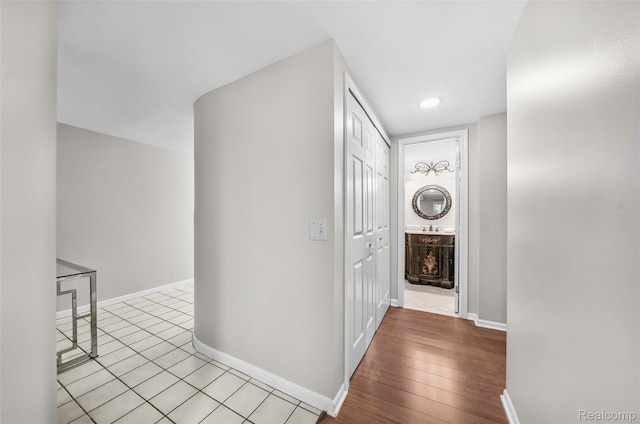 3553 Port Cove Dr Unit 39, Waterford, MI 48328 - corridor featuring baseboards and wood finished floors