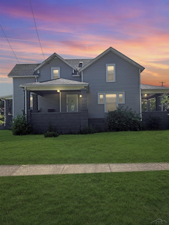 2024 Cooper Ave, Saginaw, MI 48602 - traditional-style home featuring a yard, a carport, and covered porch