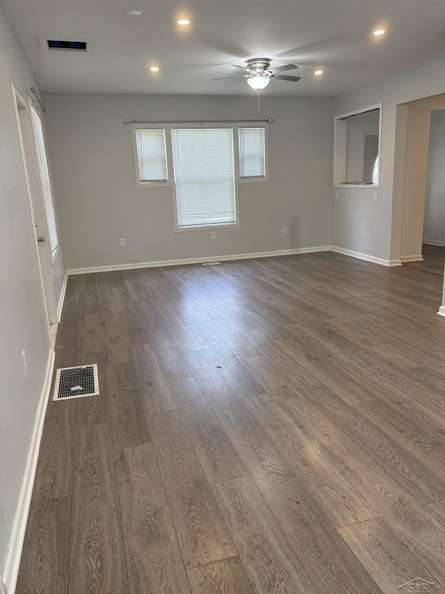 2024 Cooper Ave, Saginaw, MI 48602 - unfurnished room featuring dark wood-style floors, a ceiling fan, and recessed lighting