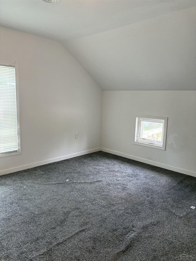2024 Cooper Ave, Saginaw, MI 48602 - additional living space featuring lofted ceiling and dark carpet